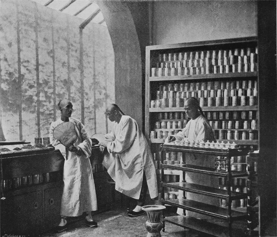 Historical photograph of Chinese tea dealers with tea chests before 1898