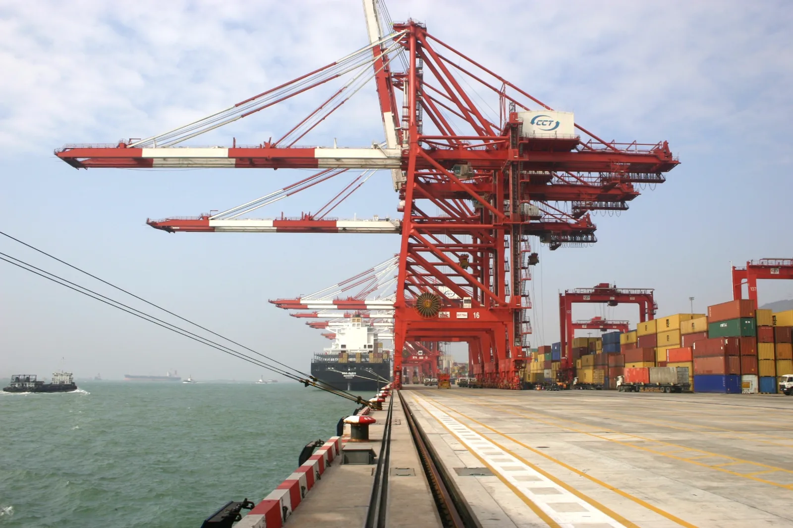 Container ship, cranes and stacked containers at Chiwan Container Terminal in Shenzhen, China