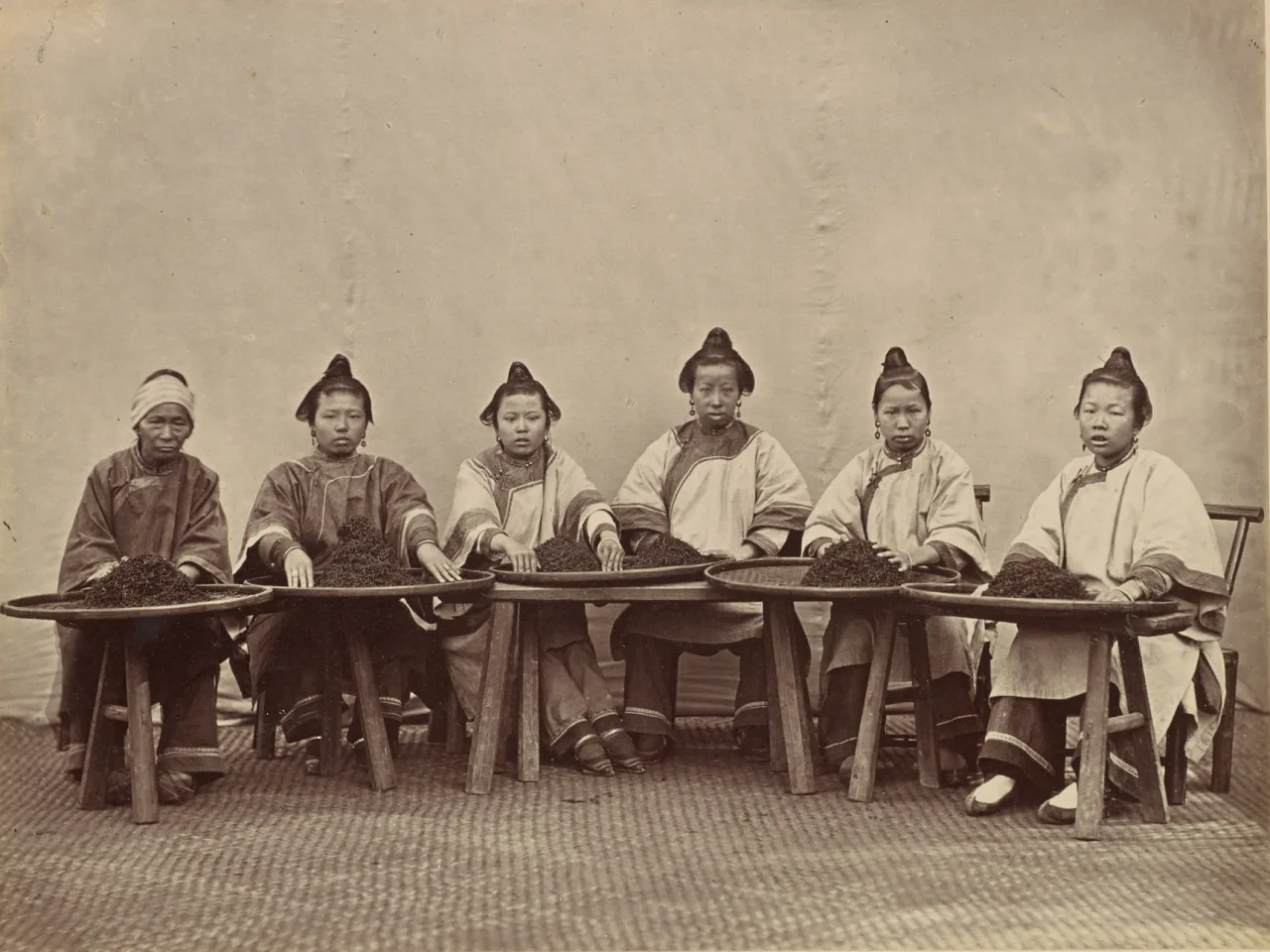 Historical photograph of women sorting tea in China by Lai Afong