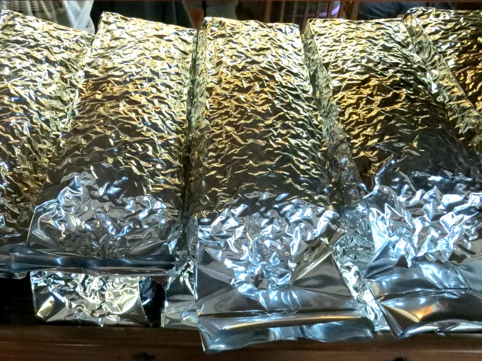Genuine photograph of Chinese tea leaves sealed in unlabelled foil packages