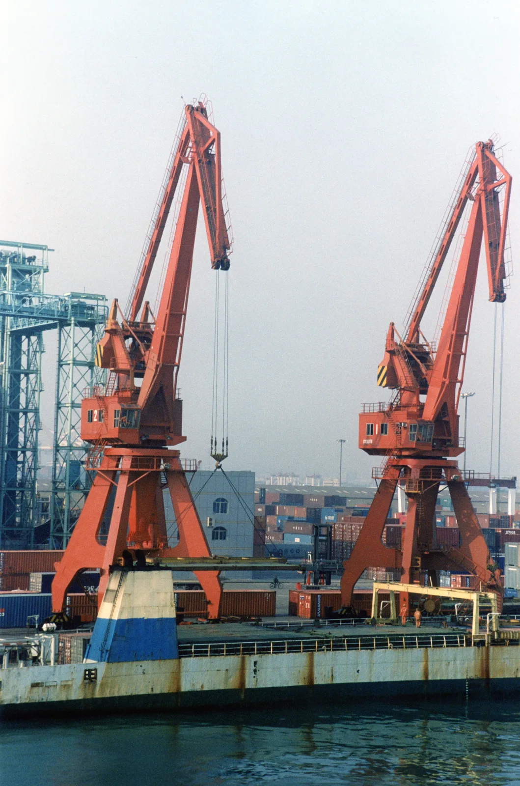 Cargo cranes and containers at a port in Dalian, China, in 2012